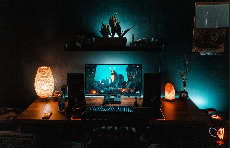 A picture of a computer with speakers on top of a desk